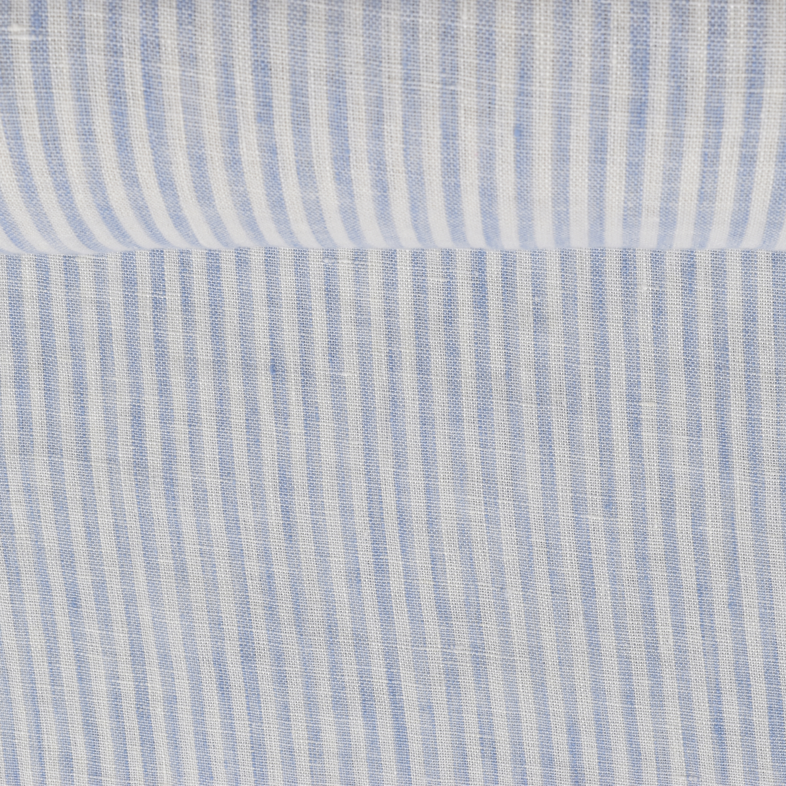 Washed striped in white and light blue linen fabric, 130 g/m²